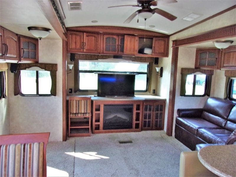 Zoomed out view of living area in camper vehicle - find and buy more private automobiles at Maltz Auctions in New York