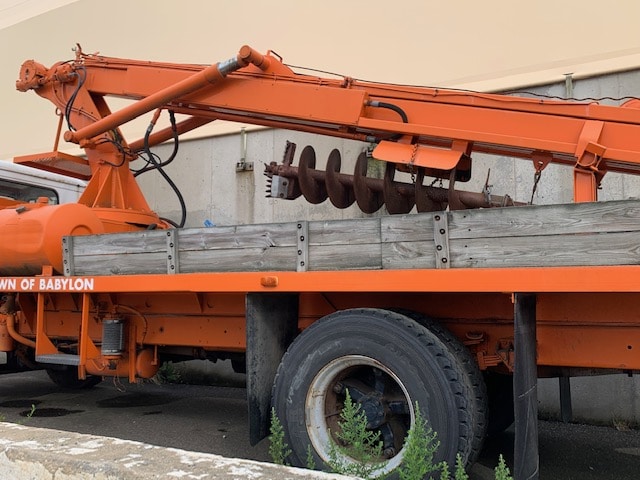 Truck with heavy equipment up for auction at Maltz Auctions