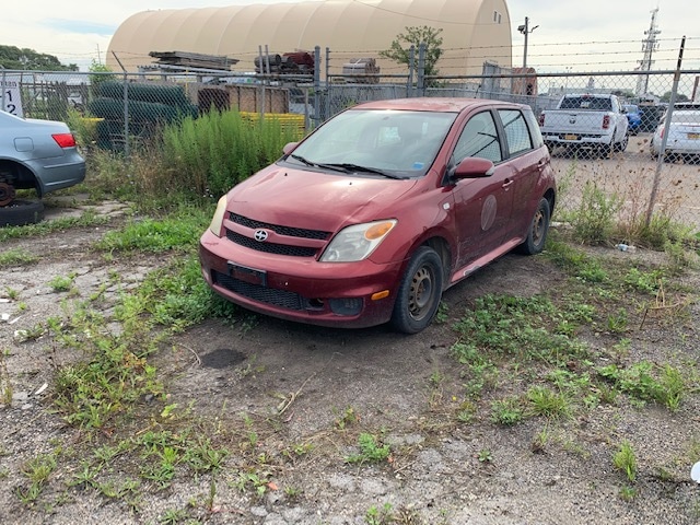 Red vehicle up for automobile auction at Maltz Auctions in New York