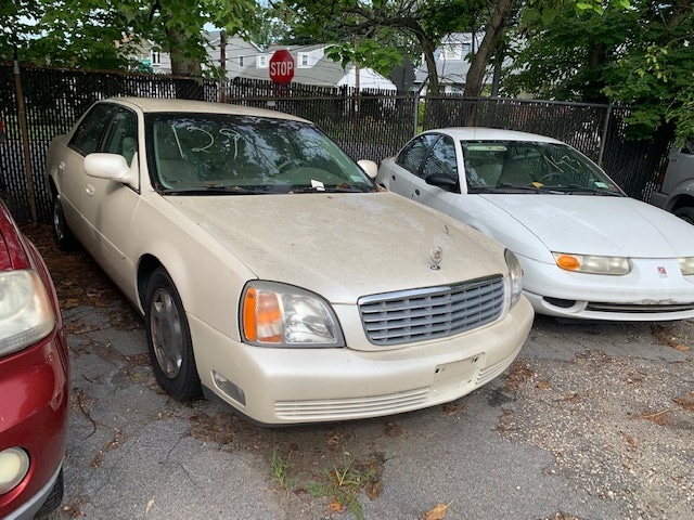 Cream-colored automobile up for auction at Maltz Auctions in NYC, New York