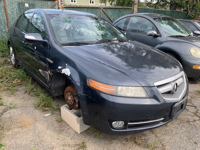 Old car in Maltz Auctions parking lot for sale at auction