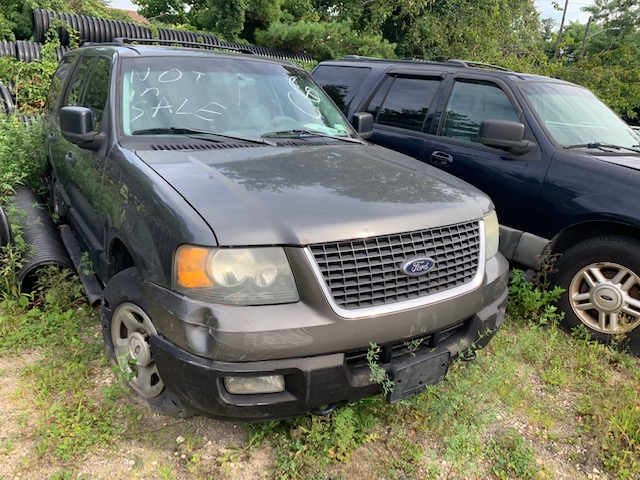 Car sitting in a field for sale at auction at Maltz Auctions in New York