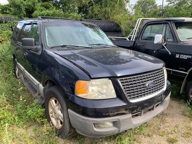 Automobile sitting in field up for auction at Maltz Auctions in New York.