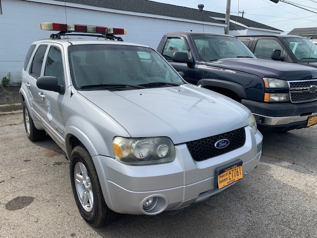 Silver car up for automobile auction at Maltz Auctions