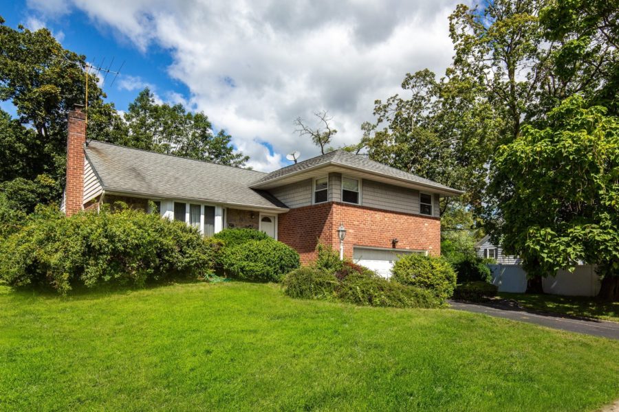 angled front view of home for sale at Maltz Auctions in New York