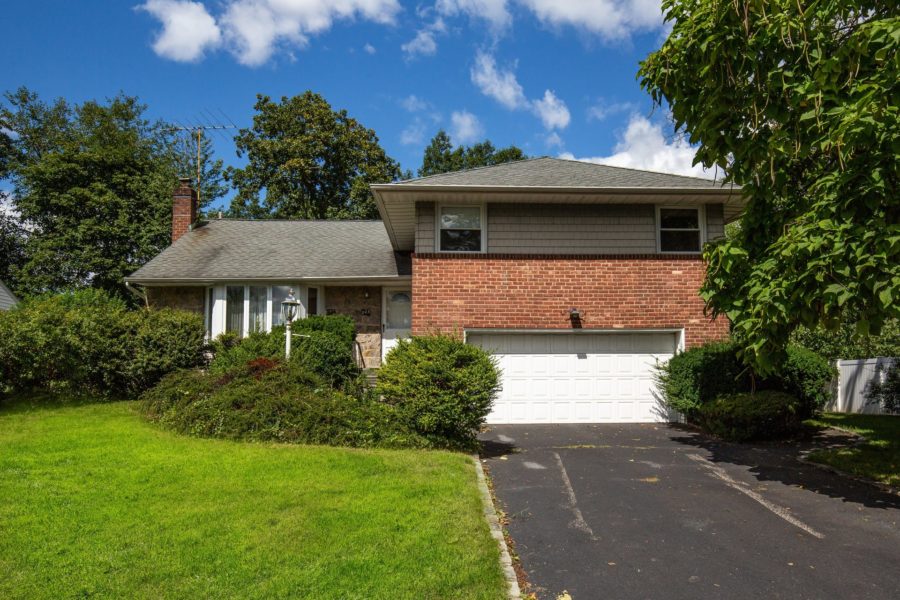 front of home for sale at Maltz Auctions in New York