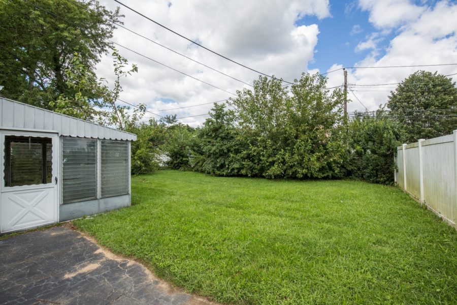 side view of backyard of land up for auction at Maltz Auctions