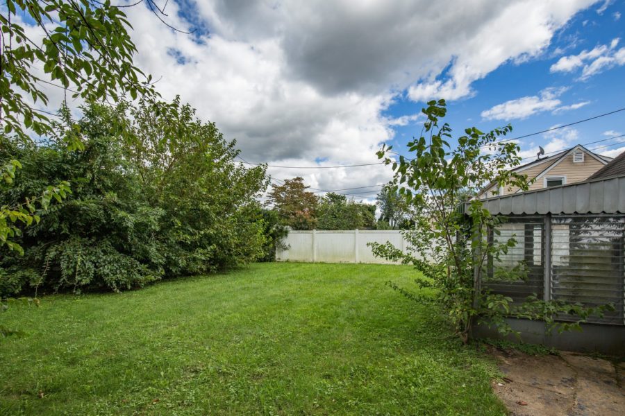 backyard of land for sale at Maltz Auctions