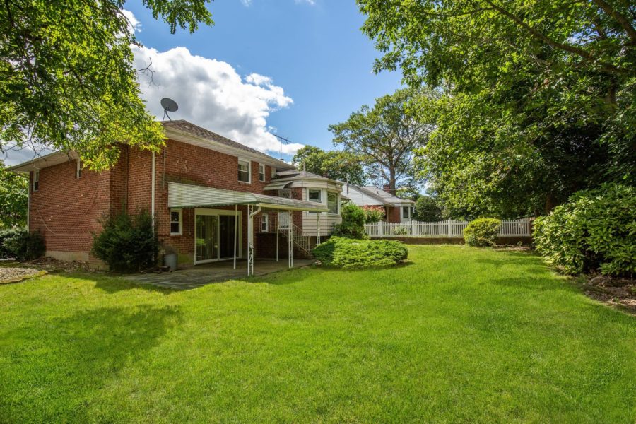 side of home for sale at Maltz Auctions