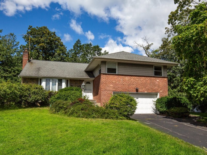 front of home for sale at Maltz Auctions