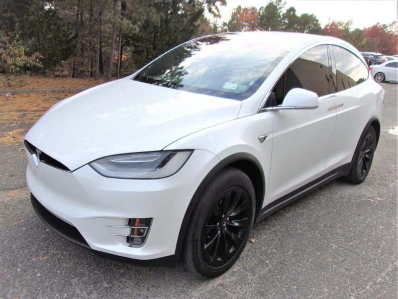 white telsa vehicle for sale at maltz auto auctions in new york city