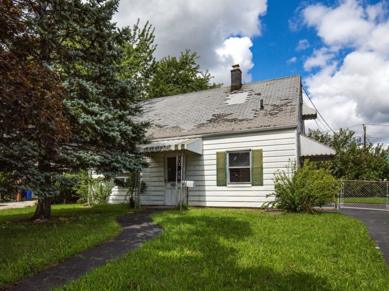 front of home for sale at Maltz Auctions in New York