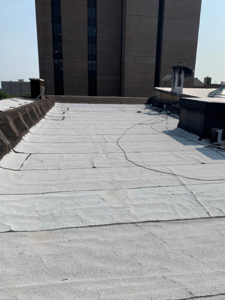 roof of mixed use building for sale by maltz auctions