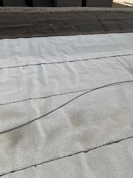 roof of mixed use building for sale by maltz auctions